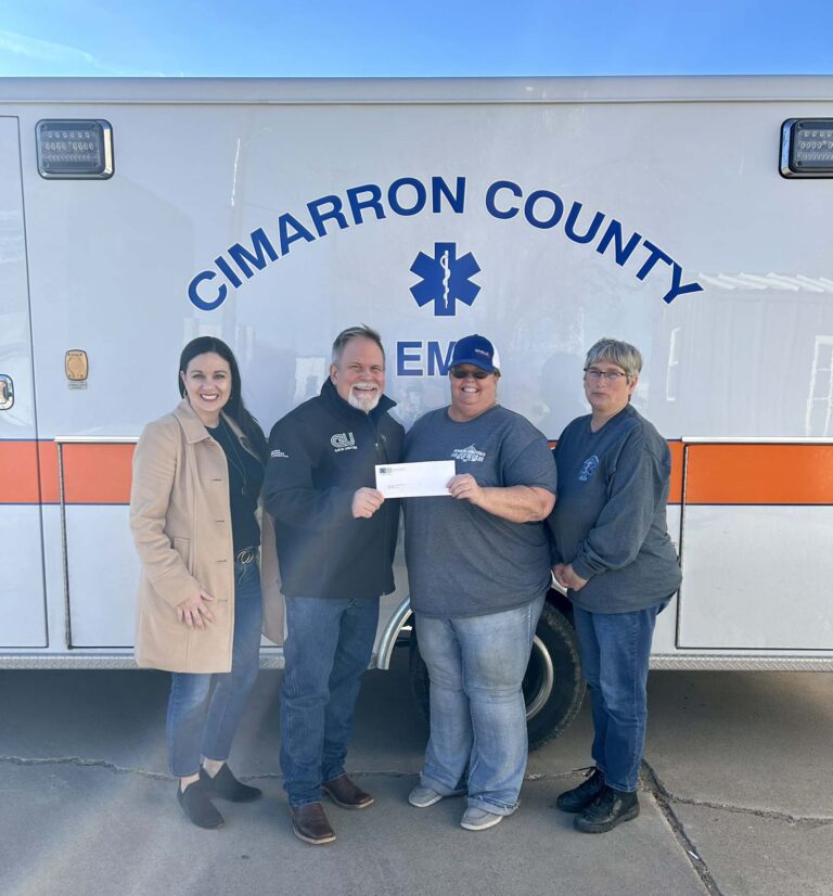 Cimarron County EMS – pictured left to right - Carrie Sanders, CSCF Executive Director; Alan Manning, Three Corners Connector Project Communications Specialist; presents check to Cheryl Taylor, CCEMS Director, and Lynn Jones