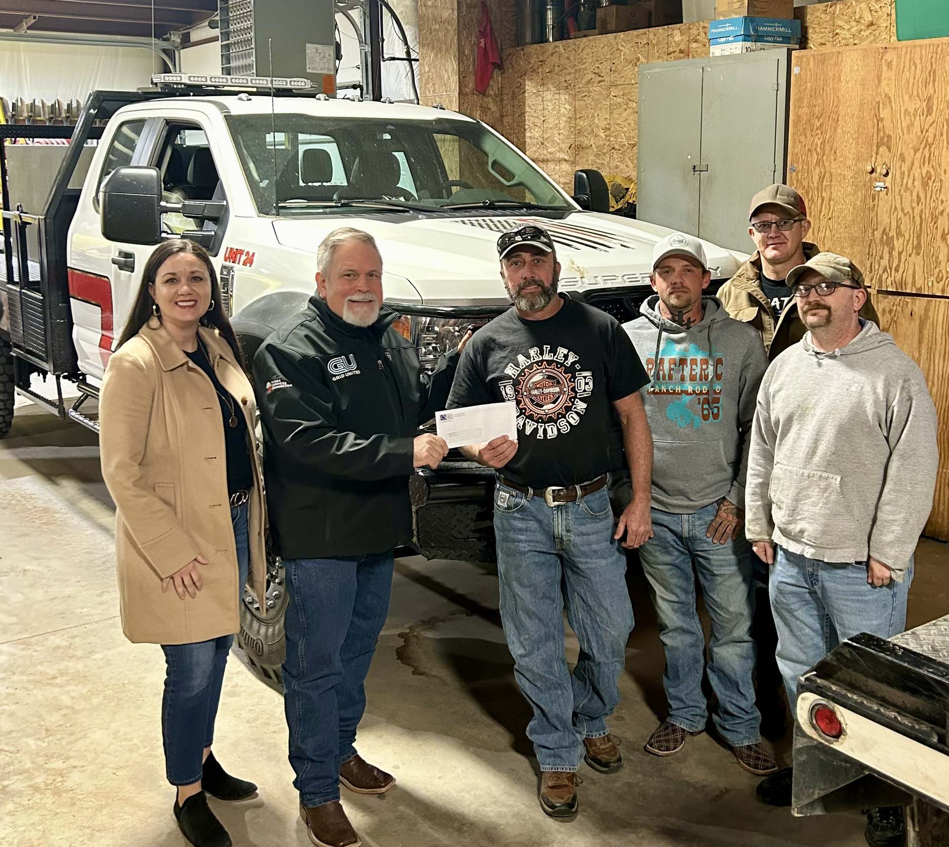 Keyes Fire Department - pictured left to right - Carrie Sanders, CSCF Executive Director; Alan Manning, Three Corners Connector Project Communications Specialist; presents check to Wade Cryer, Fire Chief; Katon Haynes; Frank Dyck; Derek Foust, Assistant Chief